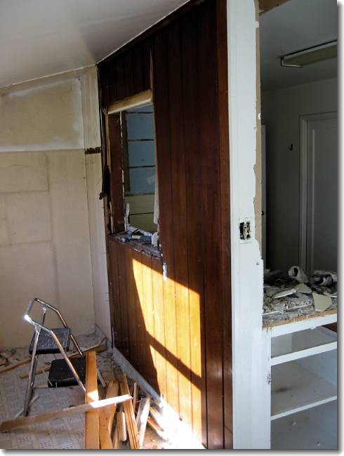 The other side of the weird wall. There's even a drain cleanout in the floor!