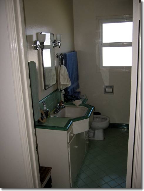 The old bathroom. Quaint tile, but the shower leaked