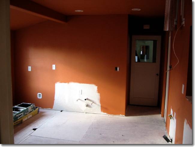 The weird wall (and the rest of the old kitchen) is now completely gone, and the walls have had a fresh coat of Tuscan Terracotta applied